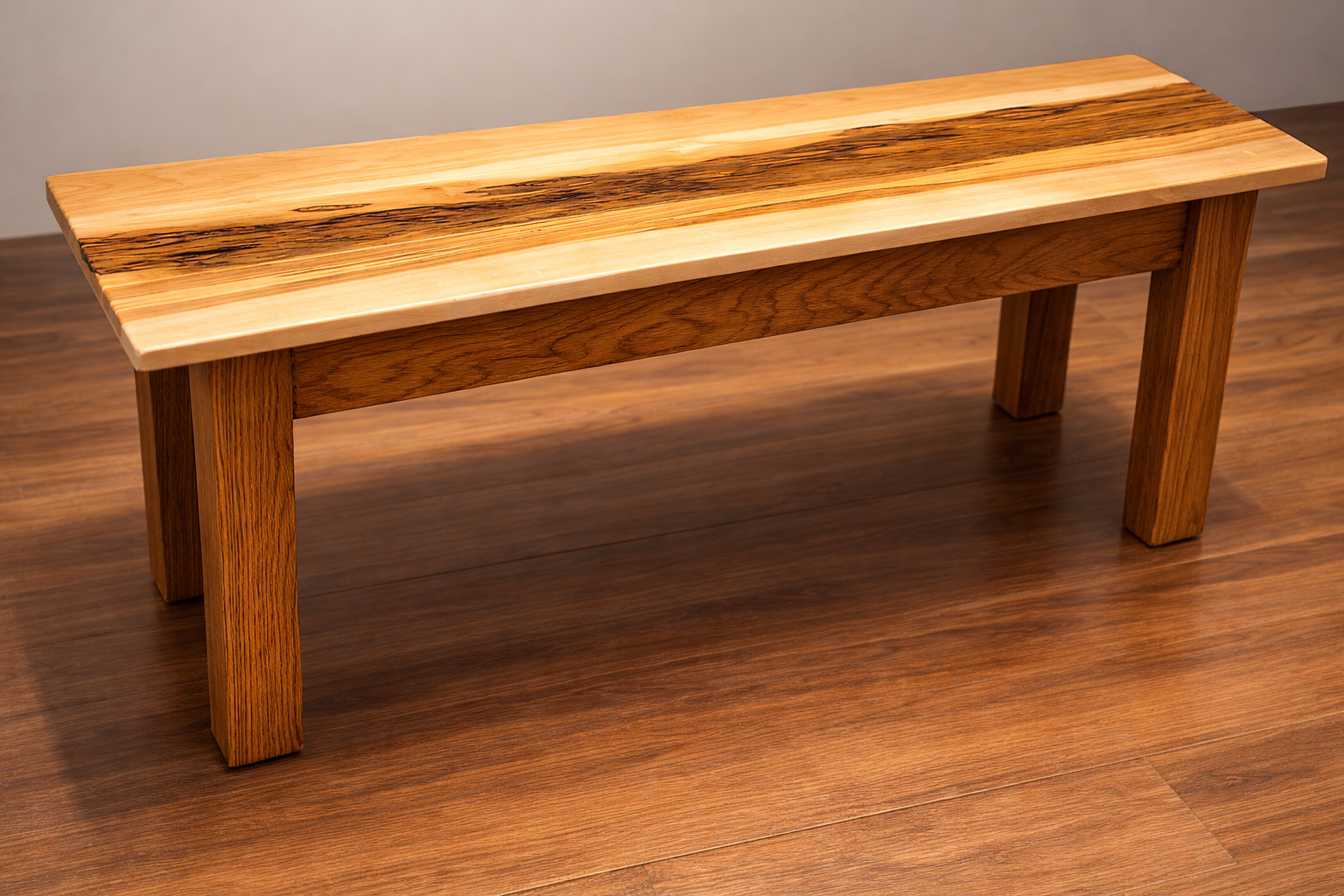 Live edge hardwood bench handcrafted from natural wood slabs with solid wood legs. A rustic seating piece showcasing the natural grain and character of the wood.