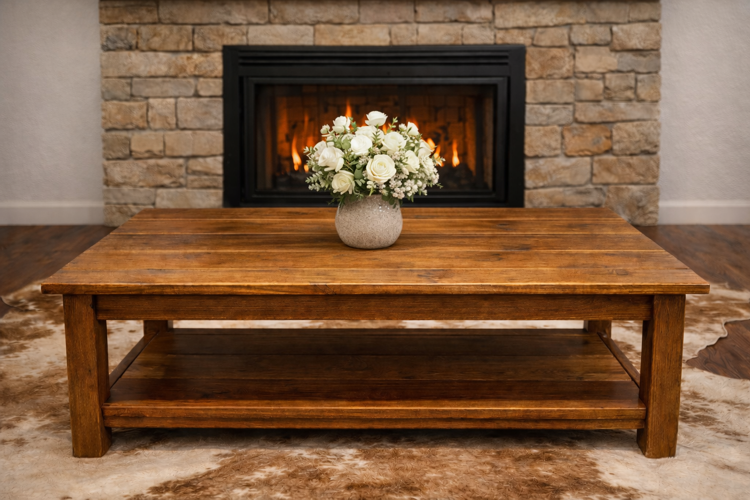 Handcrafted rustic farmhouse coffee table made from solid hardwood with a thick plank top and lower storage shelf. Built for durability and perfect for cabin and farmhouse-style living rooms.