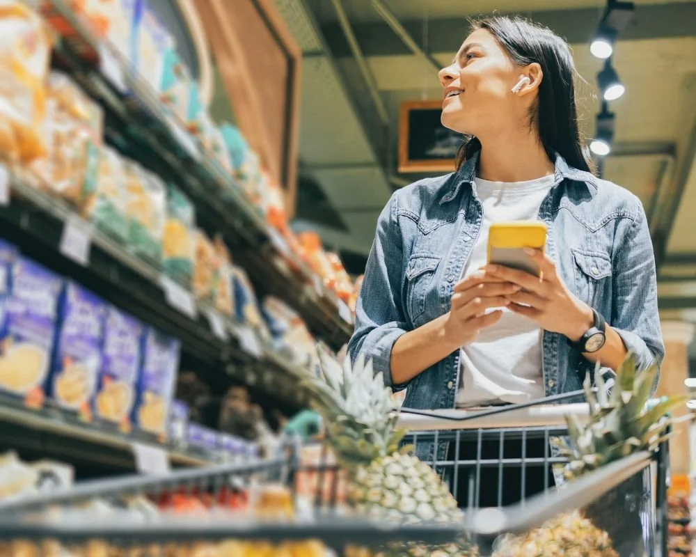 A woman shopping in a grocery store, like the one that is proposed to be built at Menangle Park.