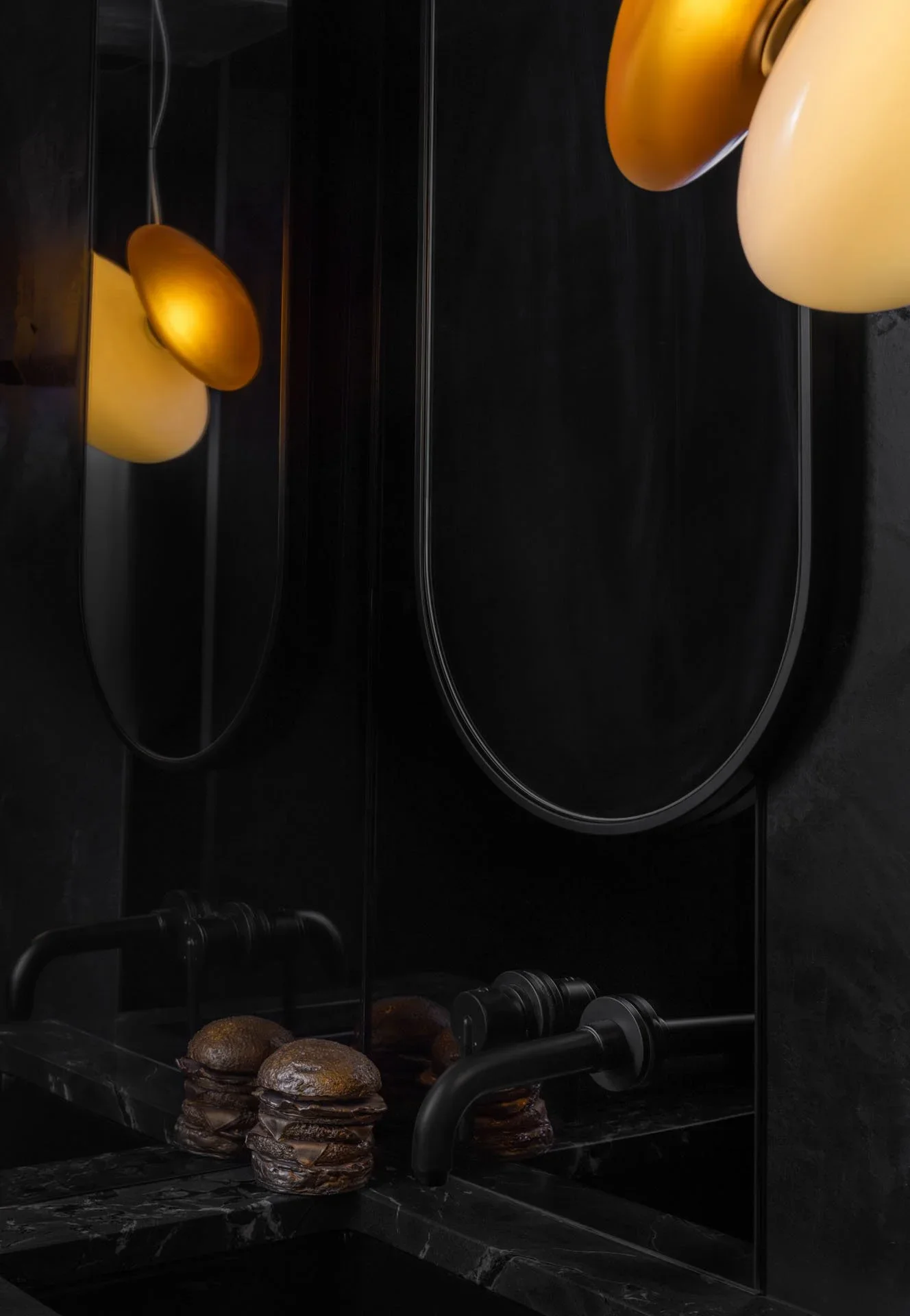 MDID_Leschi_Bronze-Burger-black-mirror-moody-bathroom.webp