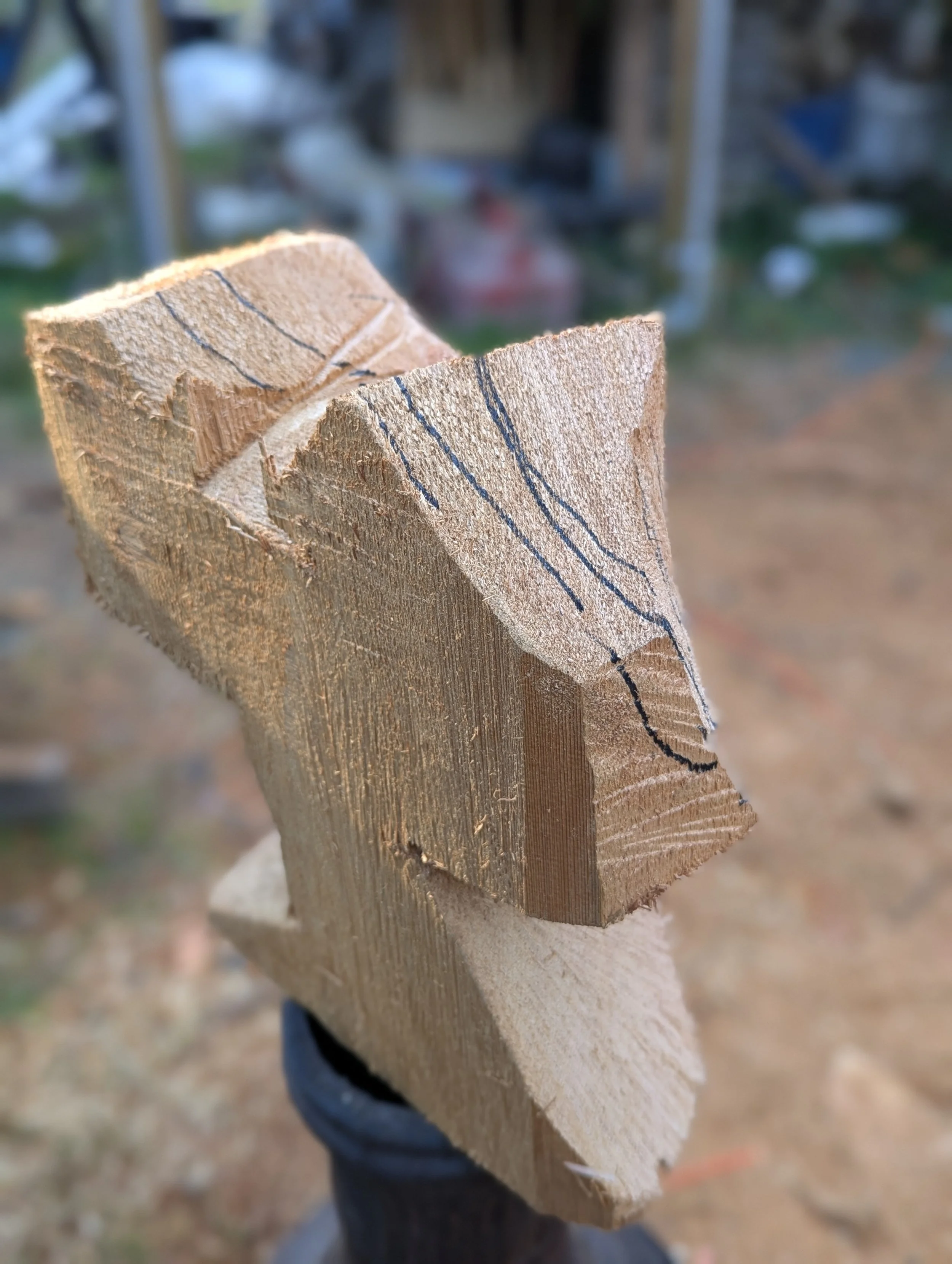 Owl in the beginning stage of carving, with chainsaw, by Justin Spalek 