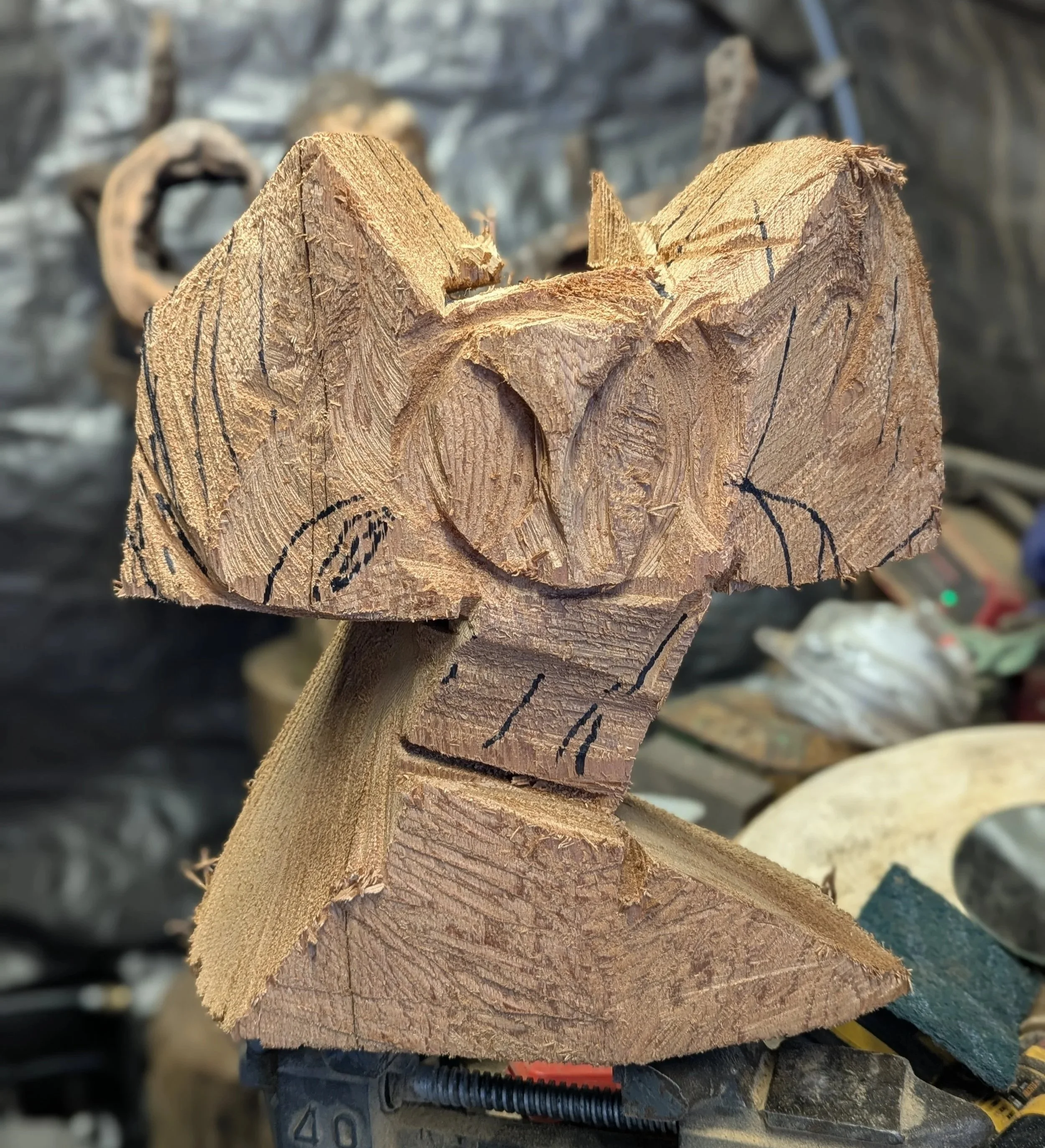 Owl in the beginning stage of carving, with chainsaw, by Justin Spalek 