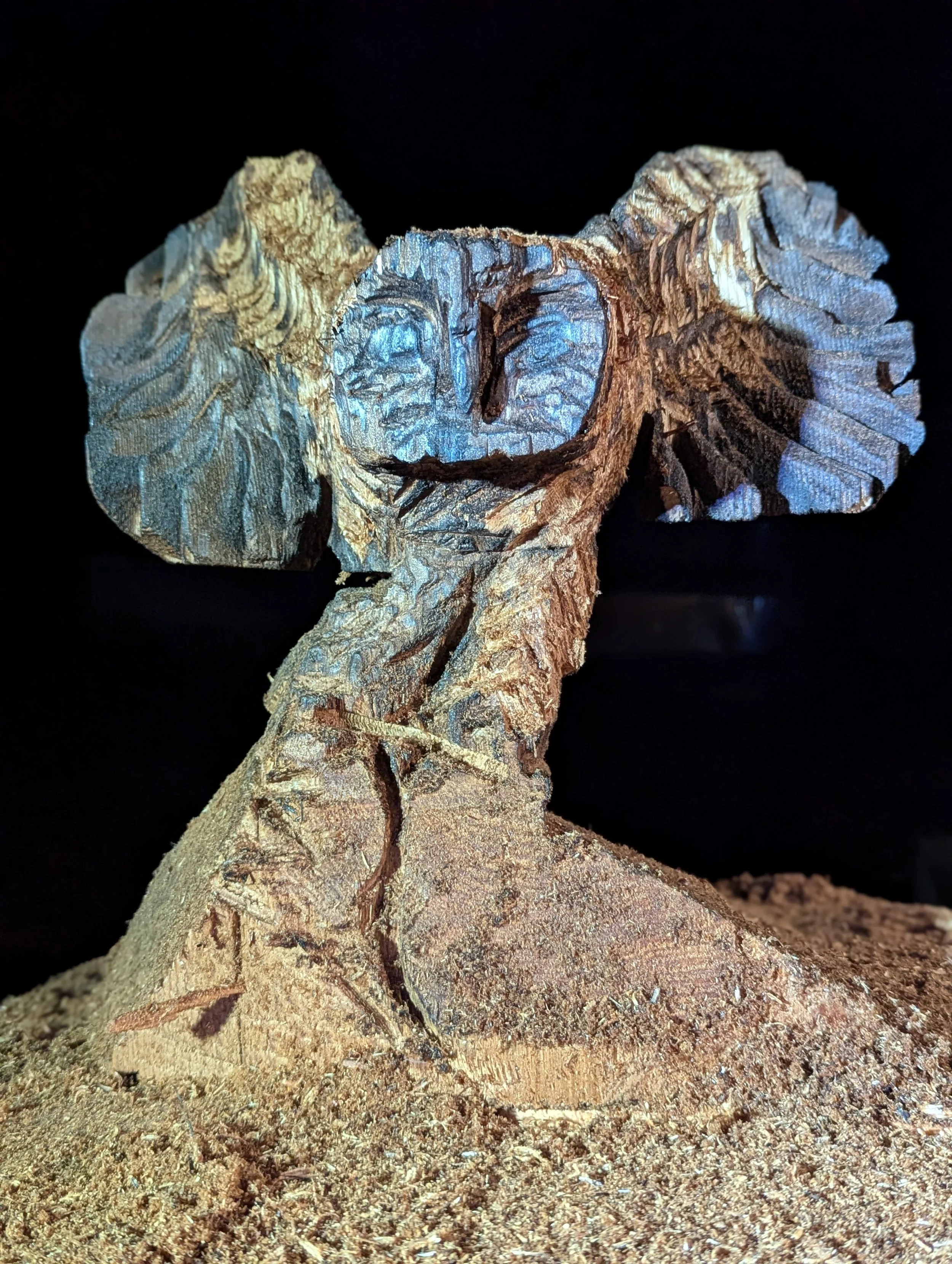 Owl by Justin Spalek - after burning, and wiping away the charred wood details are added by chainsaw