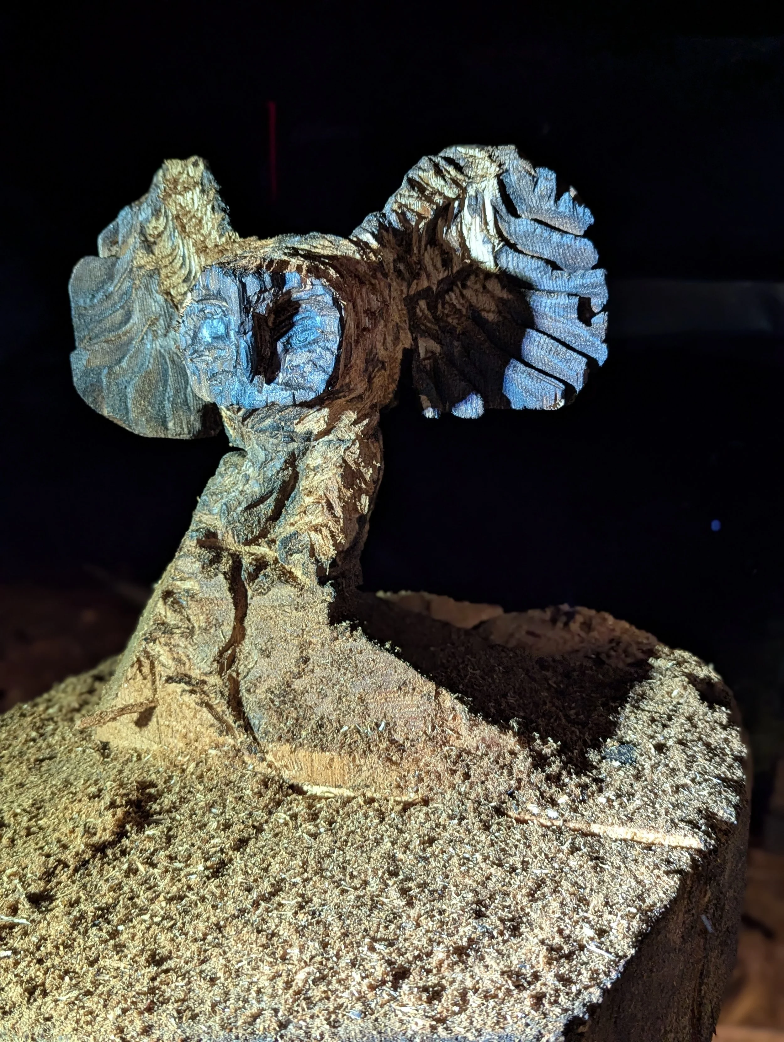 Owl by Justin Spalek - after burning, and wiping away the charred wood details are added by chainsaw