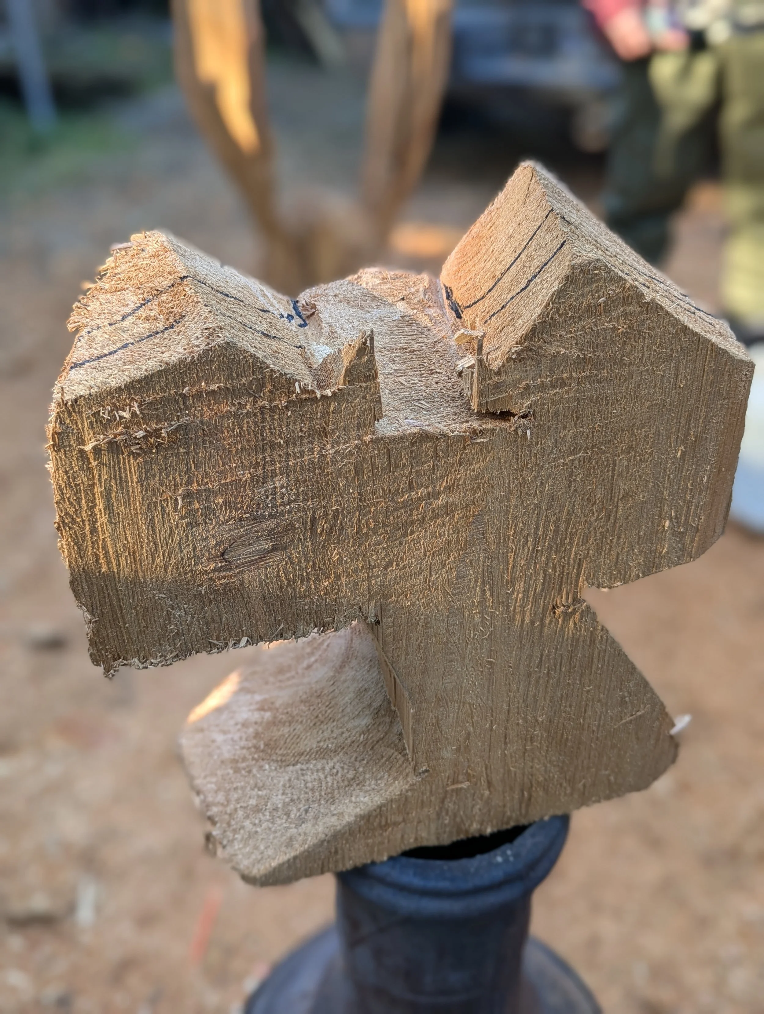 Owl in the beginning stage of carving, with chainsaw, by Justin Spalek 
