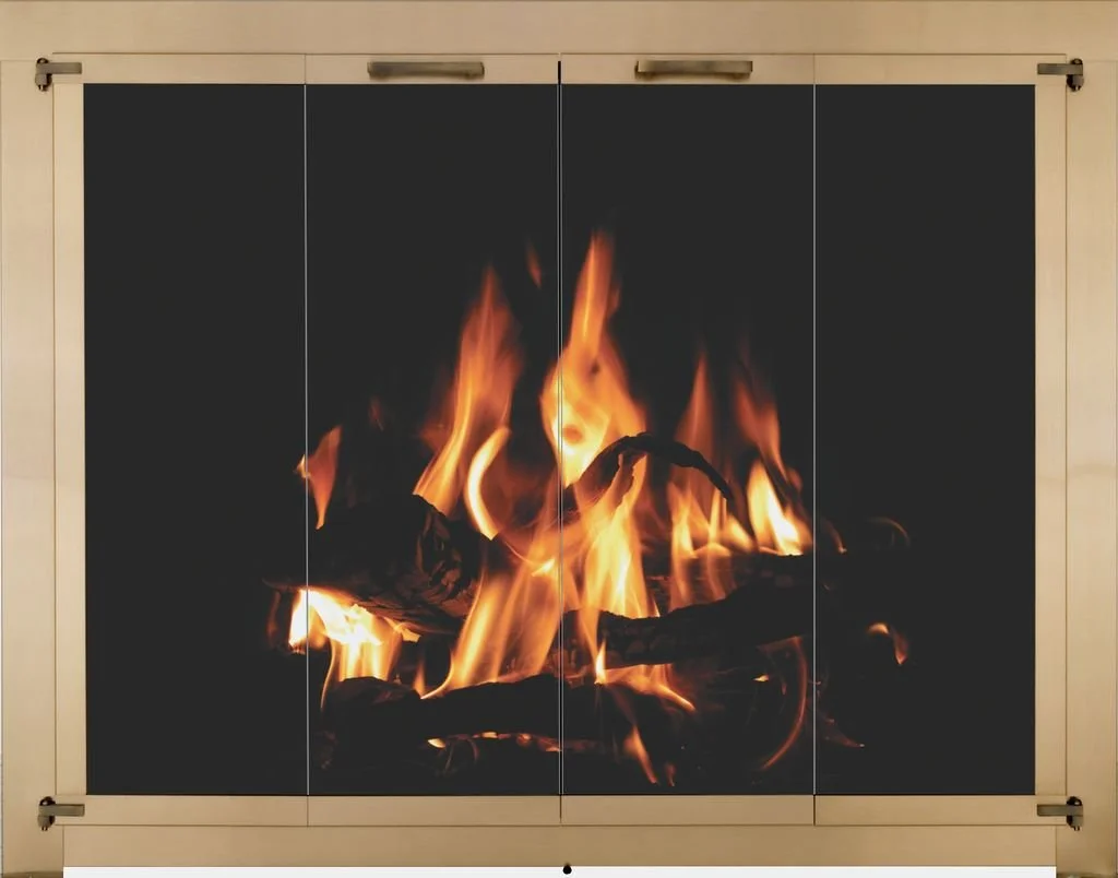 A black fireplace screen with a fire burning inside, showing flames and logs.