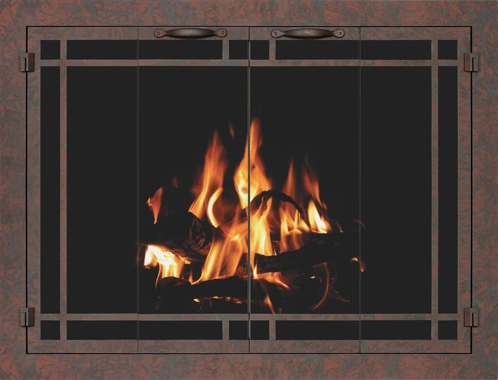 A lit fireplace with burning wood inside a metal frame.