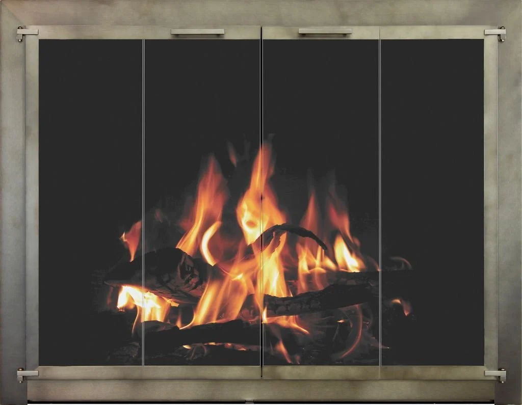 Fire burning on logs with visible flames against a black background, framed by a gray metal structure.