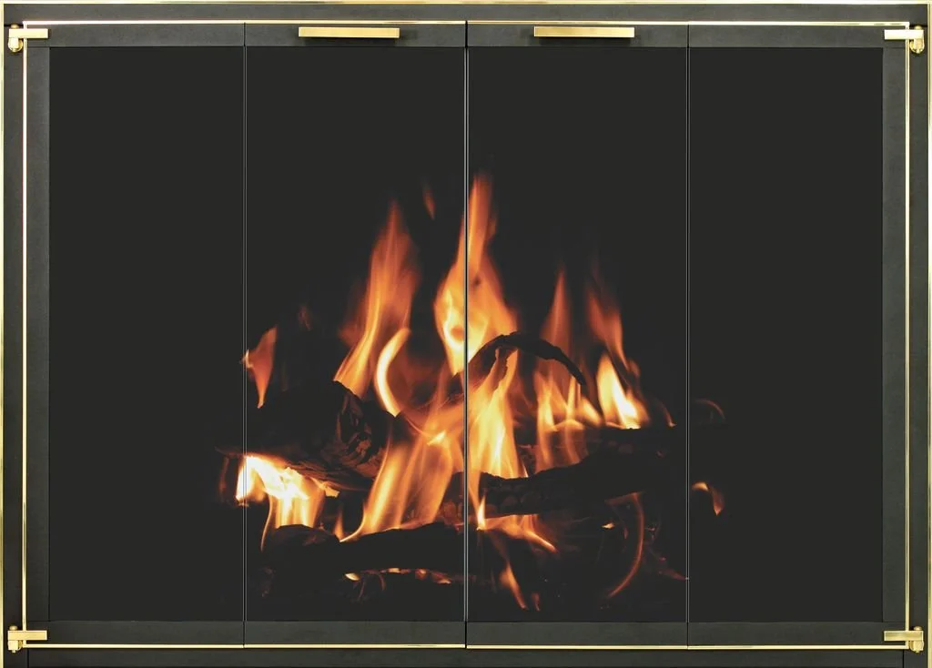 A fireplace with a fire burning on a black background, framed with a gold-colored border.