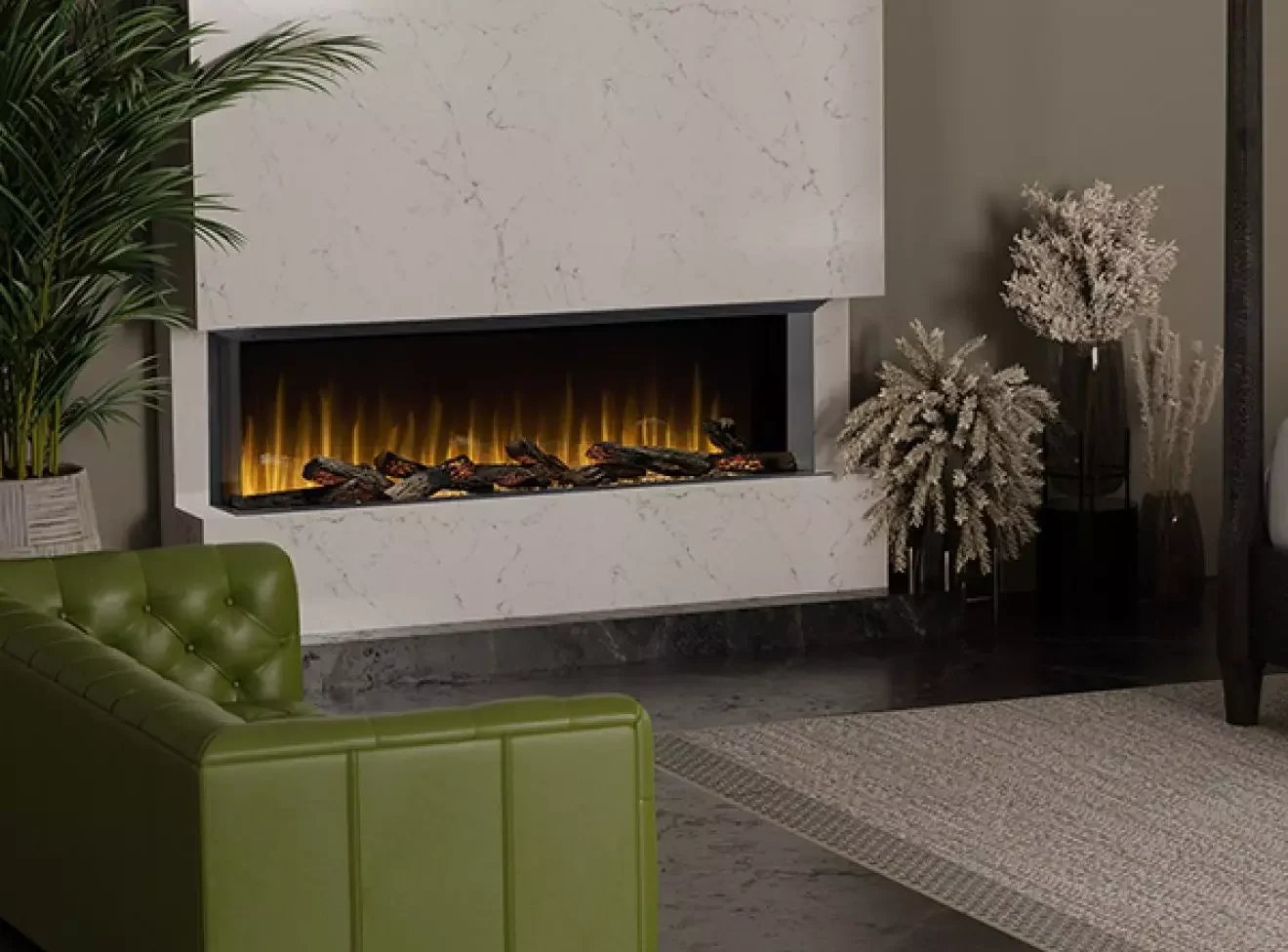 Modern living room with a white marble fireplace, green leather sofa, potted plant, and decorative dried flowers.