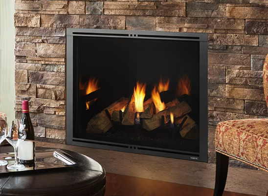 Majestic Marquis II series gas fireplace fills your home with comfort. Watch the scene unfold with an expansive view of the flames as they wrap around split logs. The authentic masonry appearance and accent lighting enhance the beautiful fire. Come h