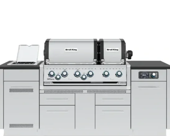 A commercial food smoker with five control knobs and a digital display, positioned between flat grilling surfaces, used for outdoor cooking and barbecue.