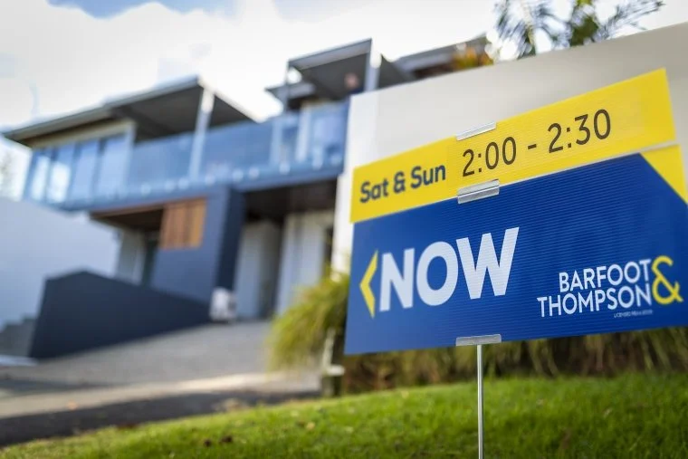 June Auckland property sales up, prices down