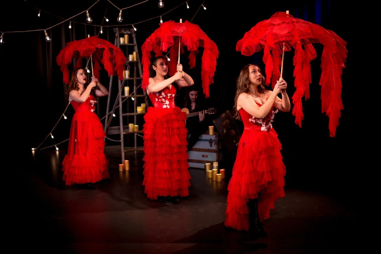 red parasols la luna.jpeg