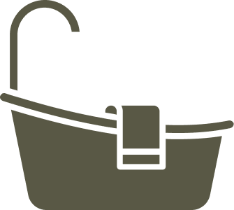 A gray bathtub with a hanging towel and a black faucet on a white background.