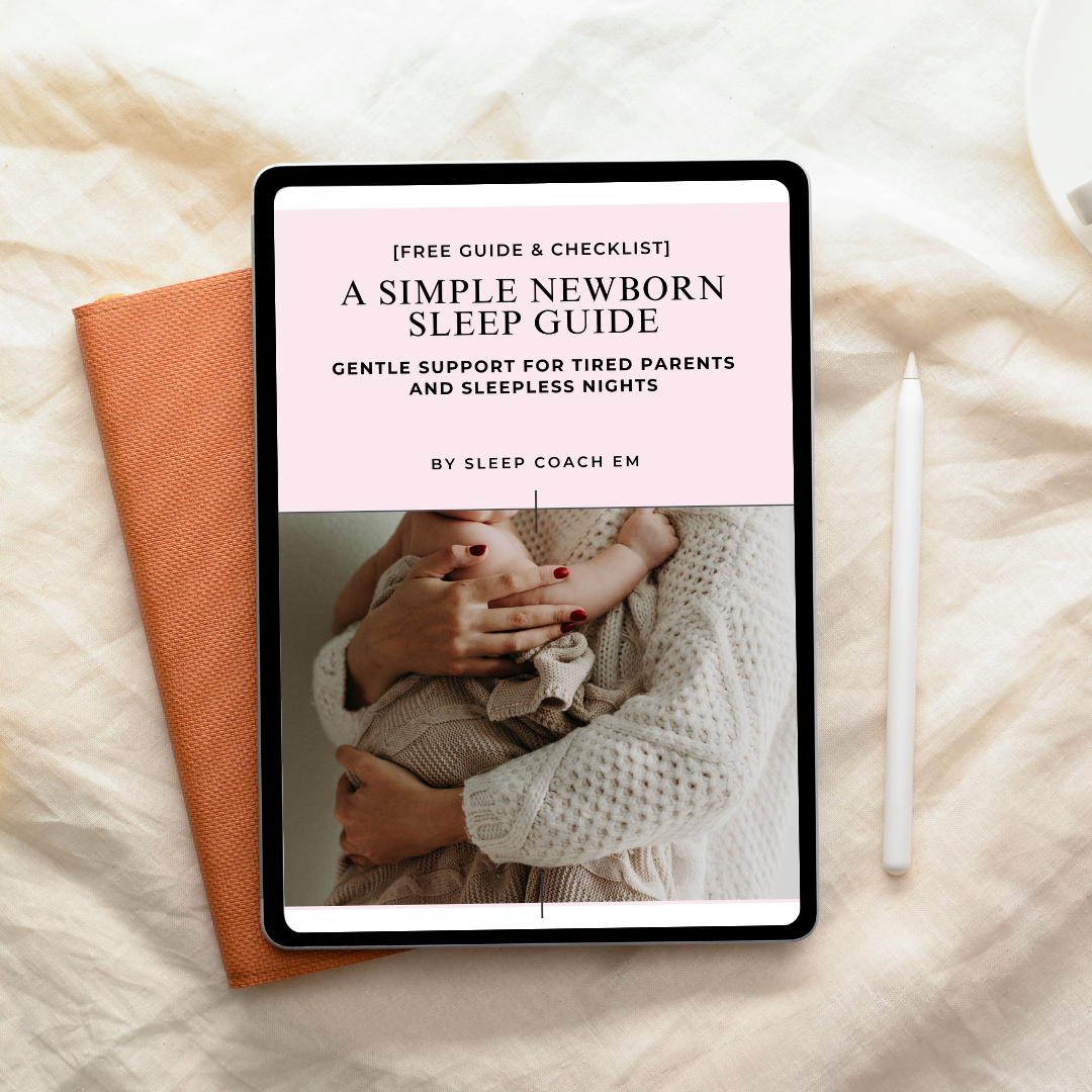 Digital tablet displaying a newborn sleep guide titled 'A Simple Newborn Sleep Guide' by Sleep Coach Em, with a photo of a woman holding a baby, placed on a beige fabric surface beside an orange cloth and a white stylus.