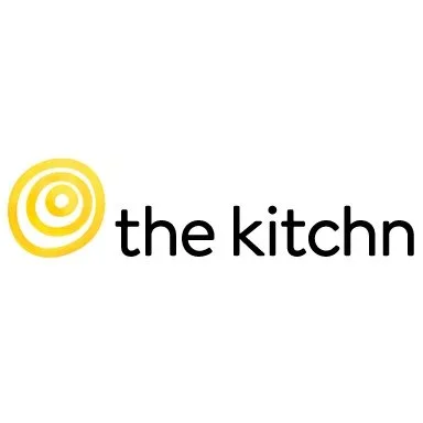 Logo with a yellow spiral symbol and the text "the kitchn" in black.