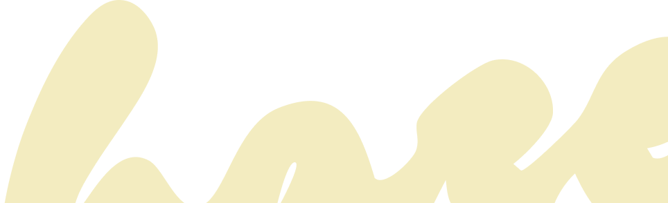 Close-up of beige cursive text on a black background
