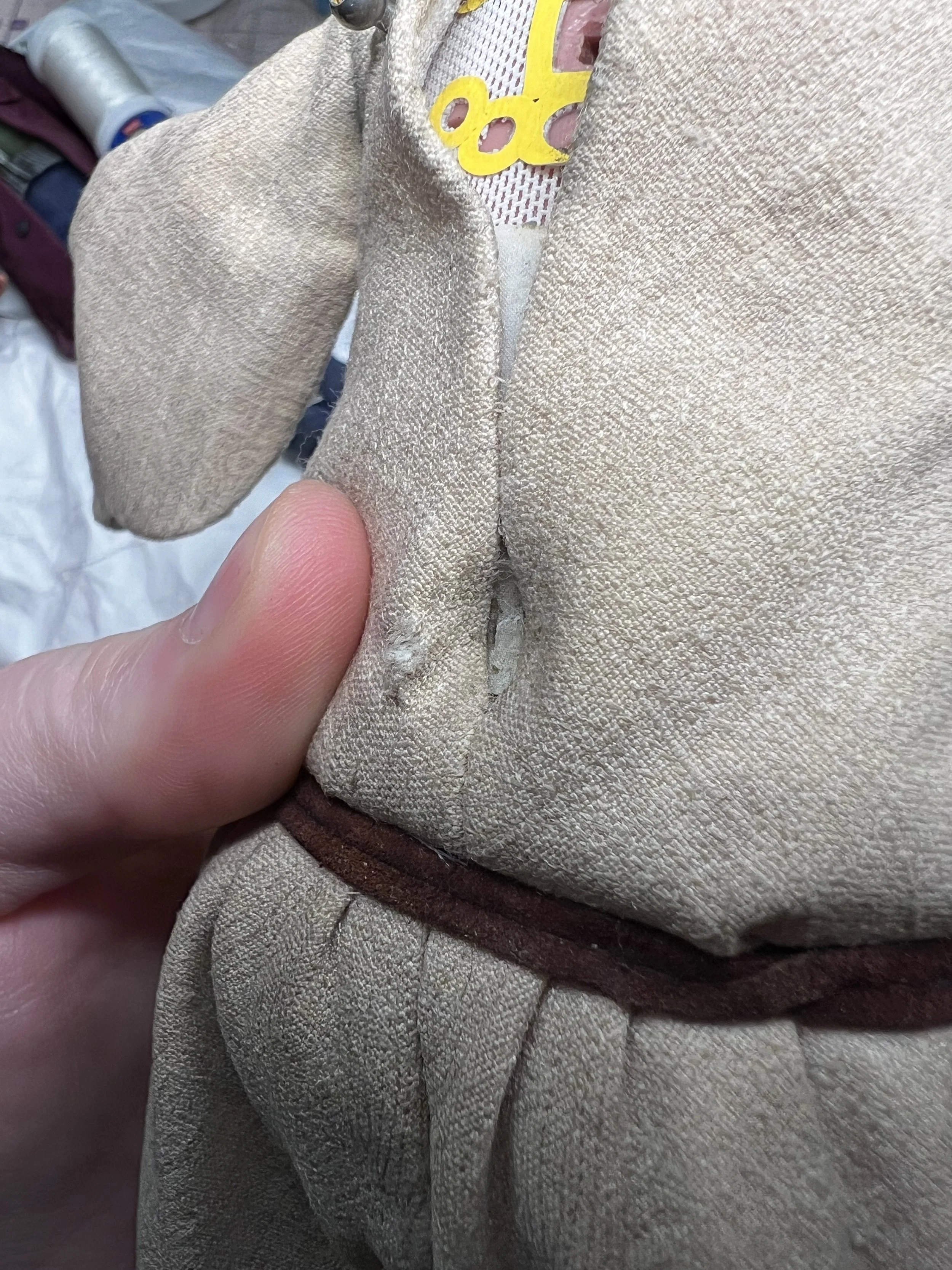 tear in costume before fix and color match