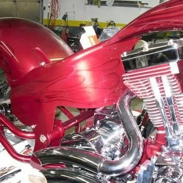 Close-up of a customized red motorcycle engine with chrome details.