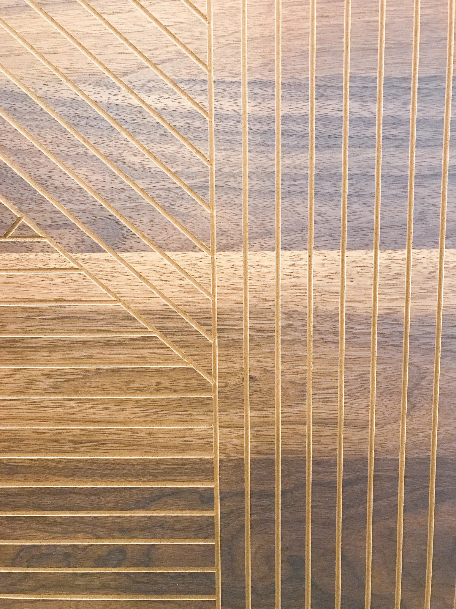 A wooden surface with a metal wire cage or rack partially covering it.