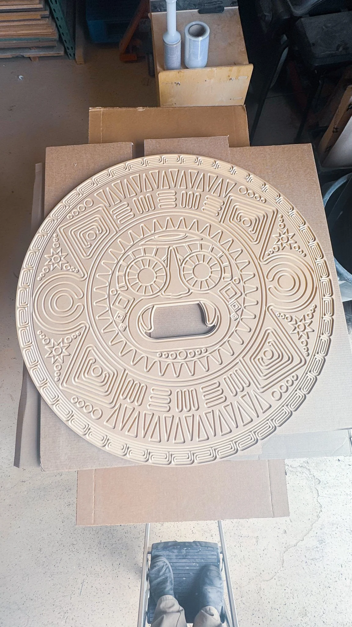 A large circular wooden carved art piece. Intricate designs and details made with a CNC router machine.