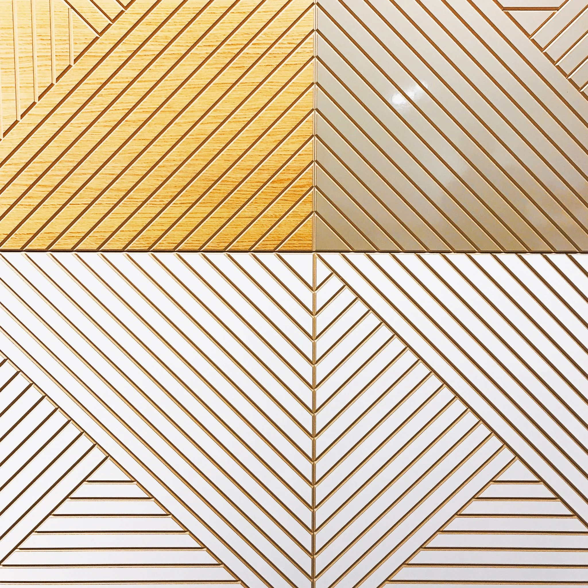 Intricate wooden ceiling with geometric pattern of parallel and diagonal lines creating diamond shapes.
