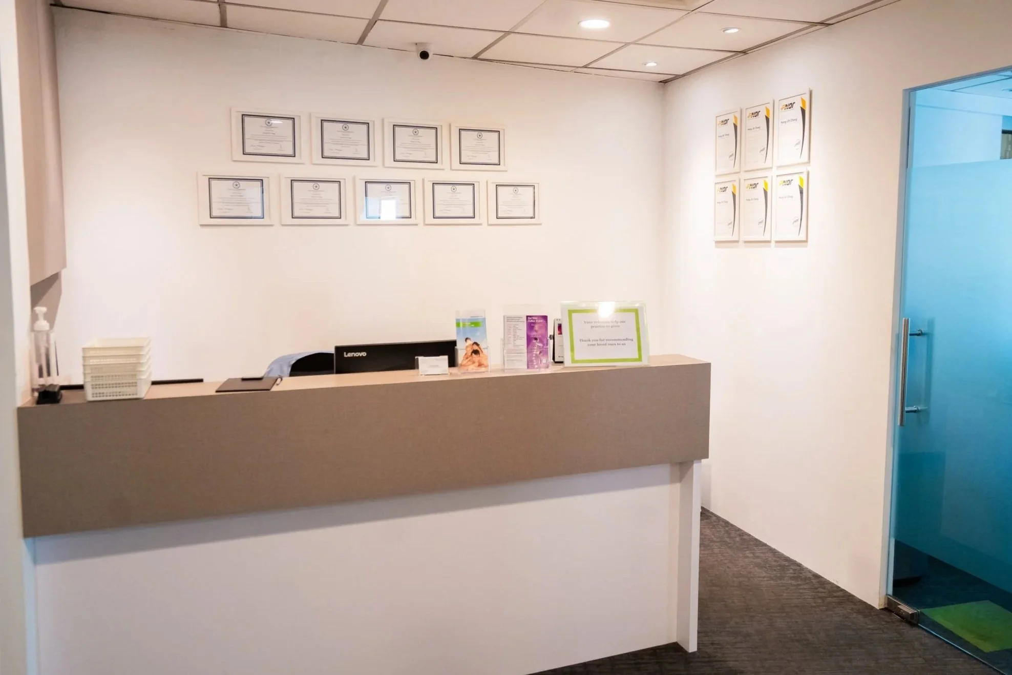 Front desk reception at chiropractic clinic in Singapore for patient check-in