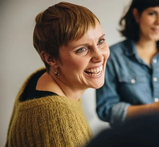 Woman smiling in Let's Talk Climate programme