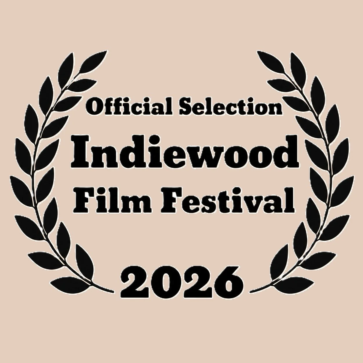 Avi Setton's The Big Break. Award emblem with black laurel wreath and bold black text that reads "Official Selection Indiewood Film Festival 2026" on a beige background.