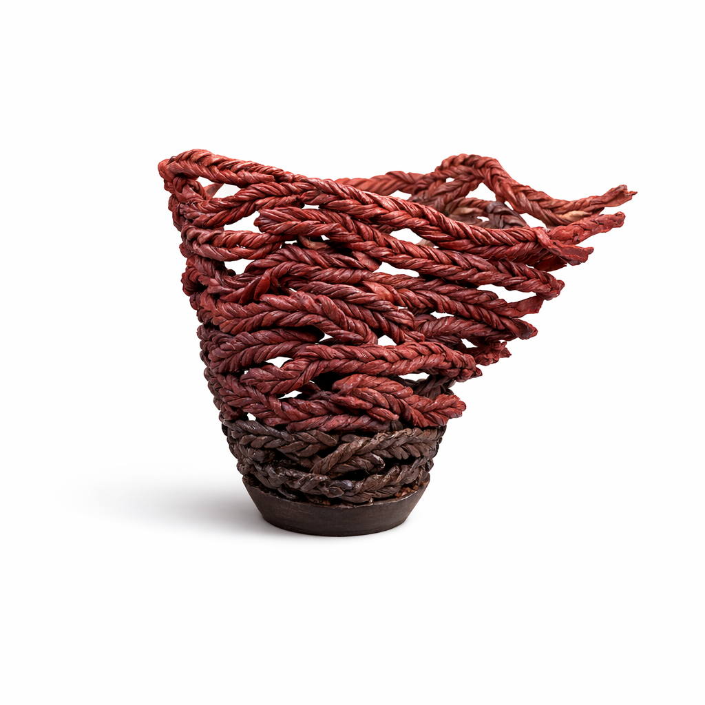 A handcrafted woven basket made of reddish-brown twisted rope material with an open top, placed on a white background.