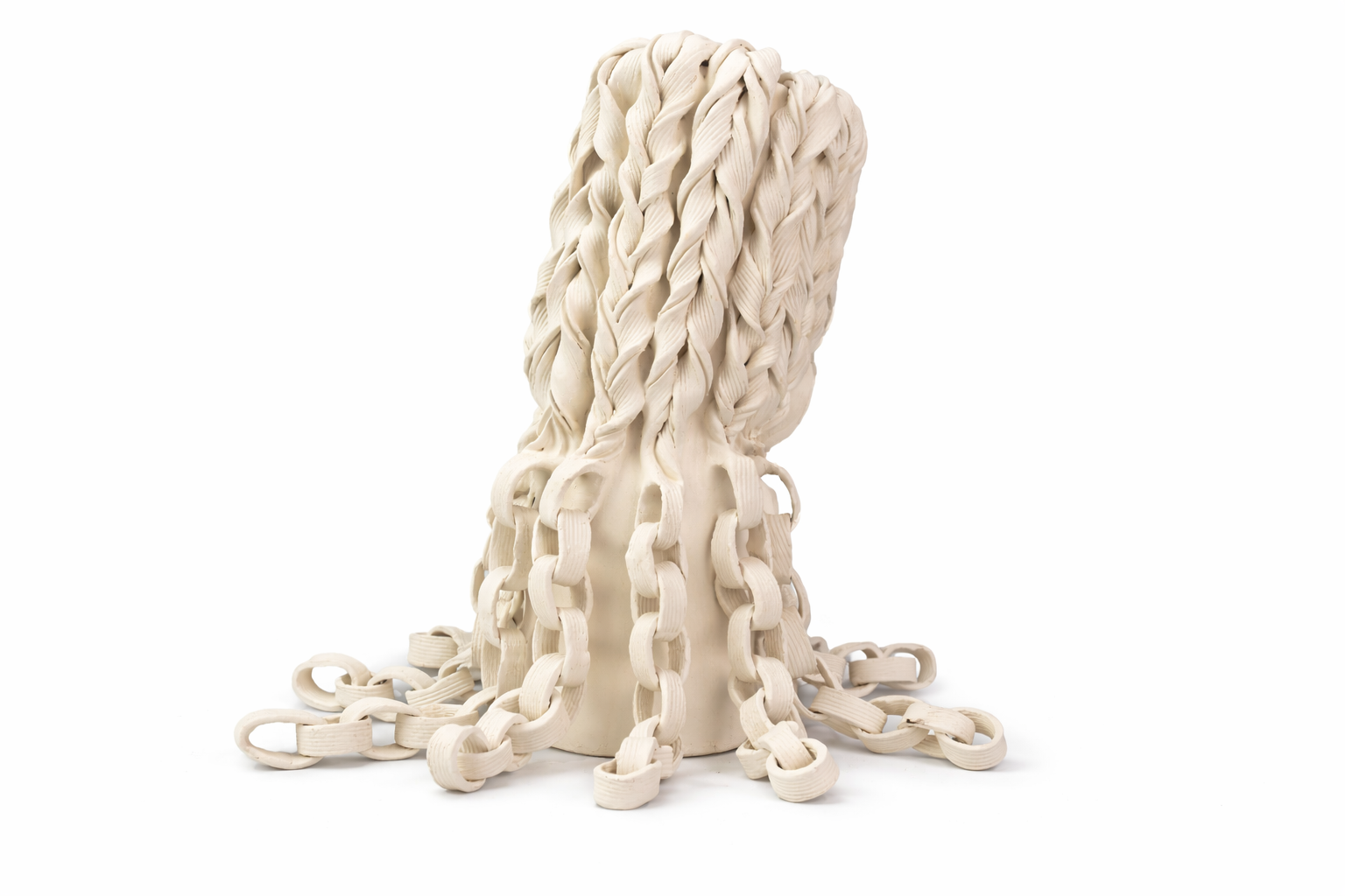 A decorative sculpture resembling a head made of intertwined white rubber strips.