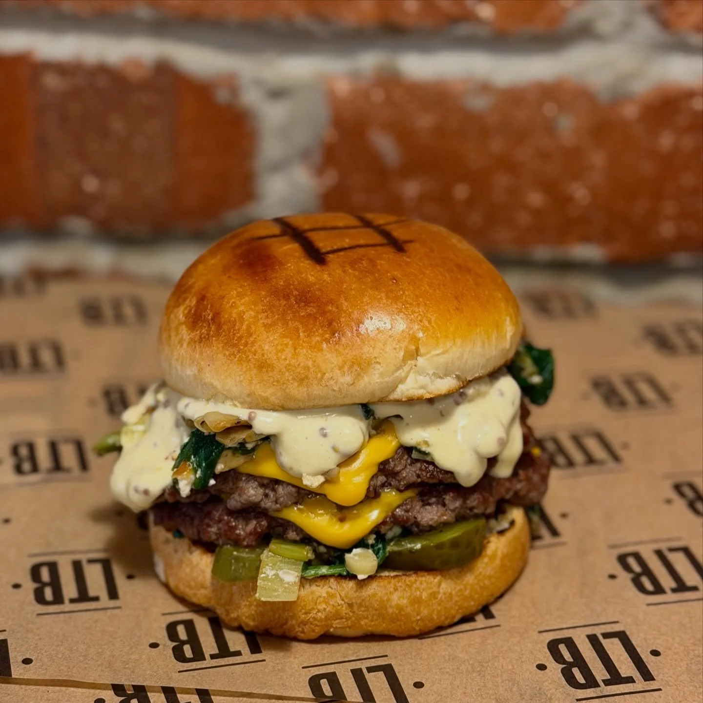 ‼️The Green Smash‼️
Two patties, sharp cheddar, crunchy gherkins, leeks, spinach and feta in butter, Dijon kick in a French brioche &mdash; because one is never enough.&rdquo; 🍔🤤