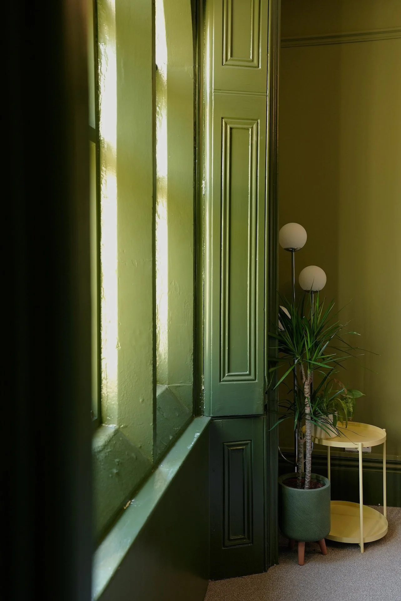  Deep green heritage hallway with restored period detailing and soft natural light by Studio EWW 