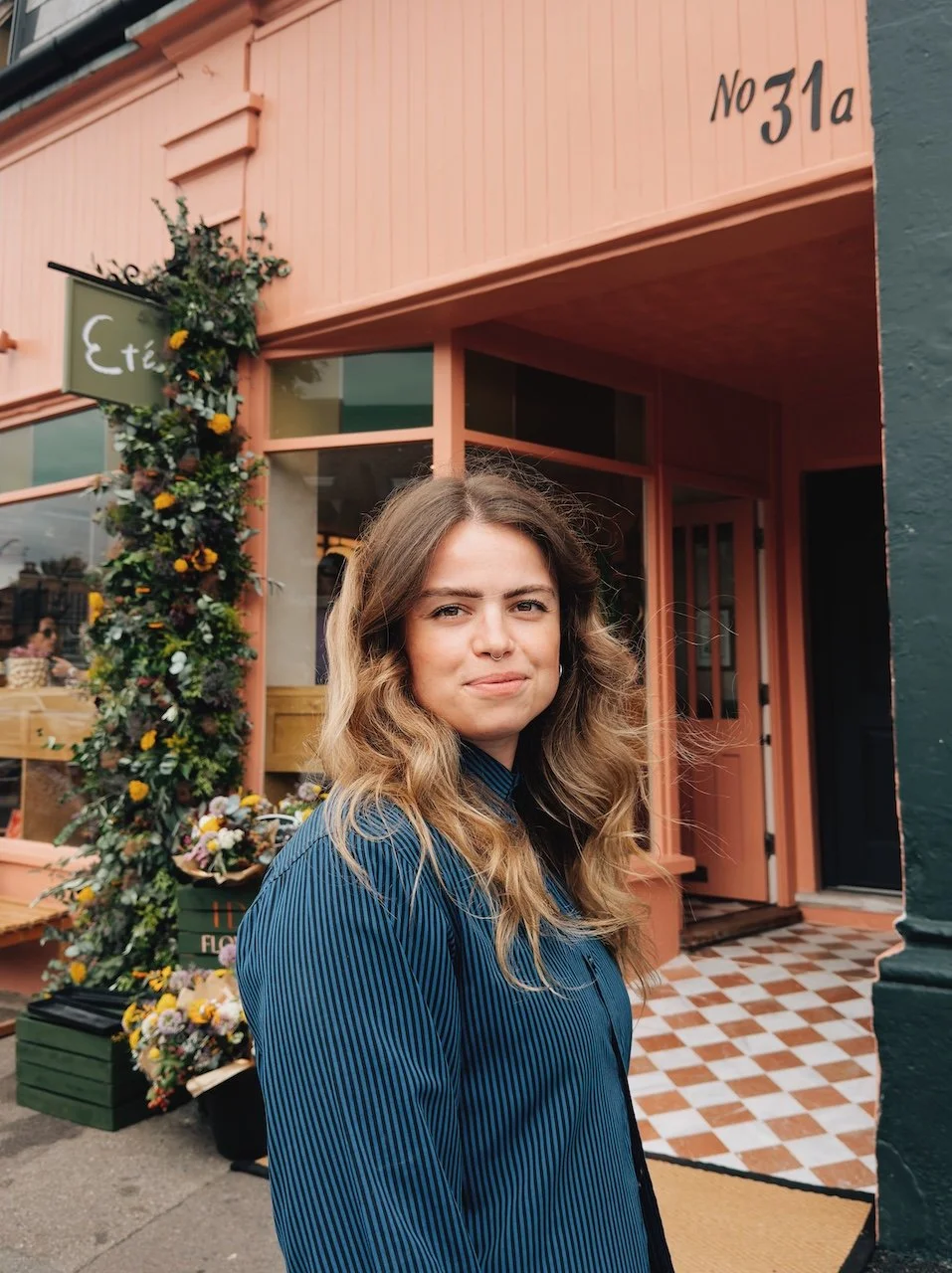 Elizabeth Walkden outside Été café refurbishment in Bournemouth showcasing Studio EWW’s contemporary hospitality and interior design approach