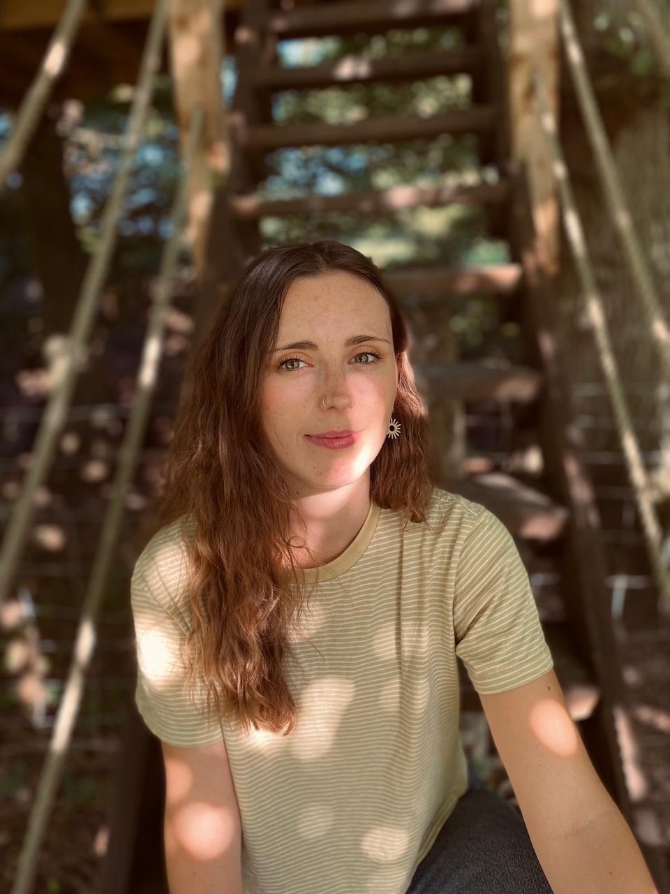 Portrait of interior designer Jodie Ashborn for Studio EWW captured in a natural outdoor setting with warm light and organic textures