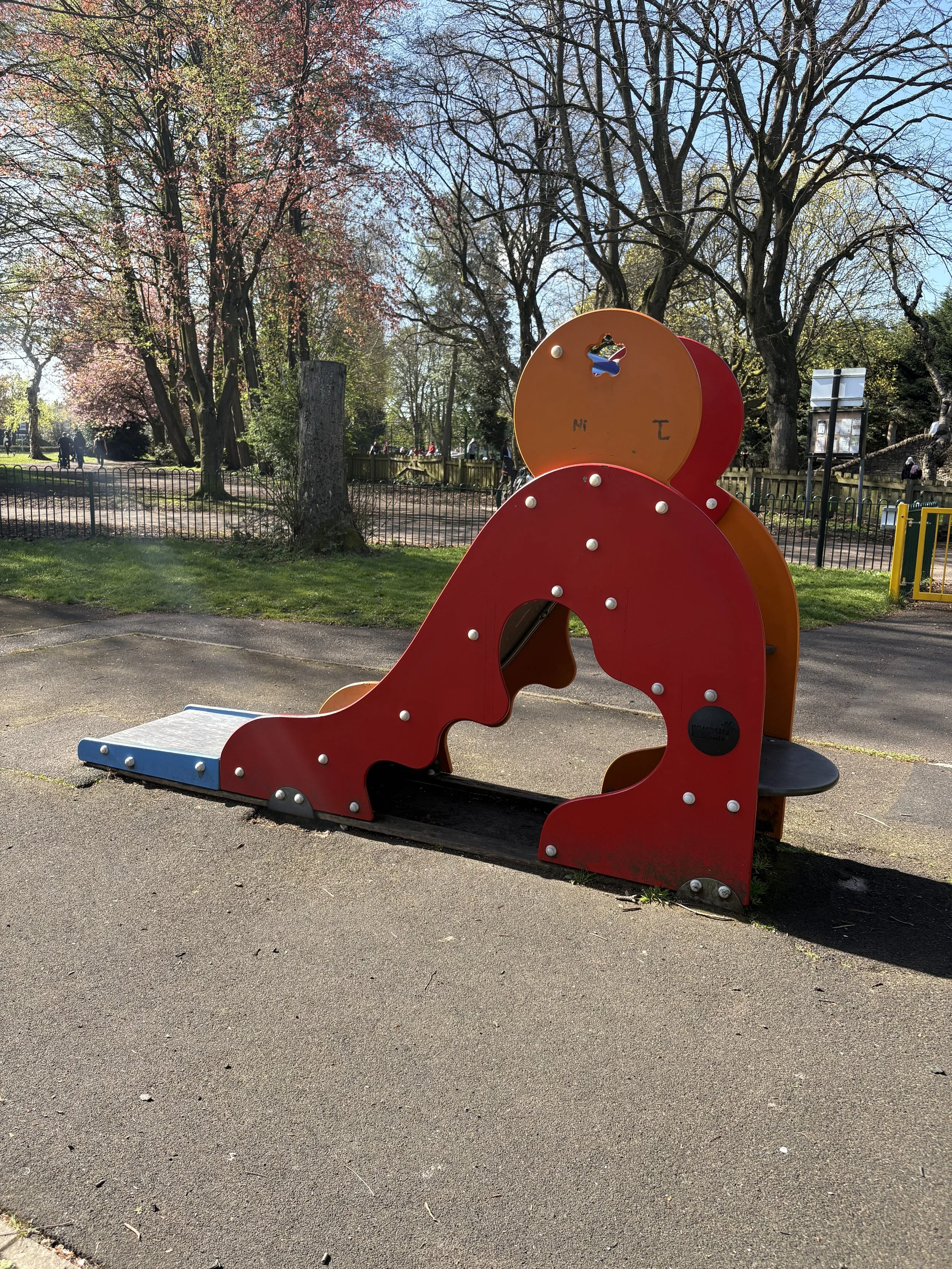 a mini slide at the children's play area in stamford park