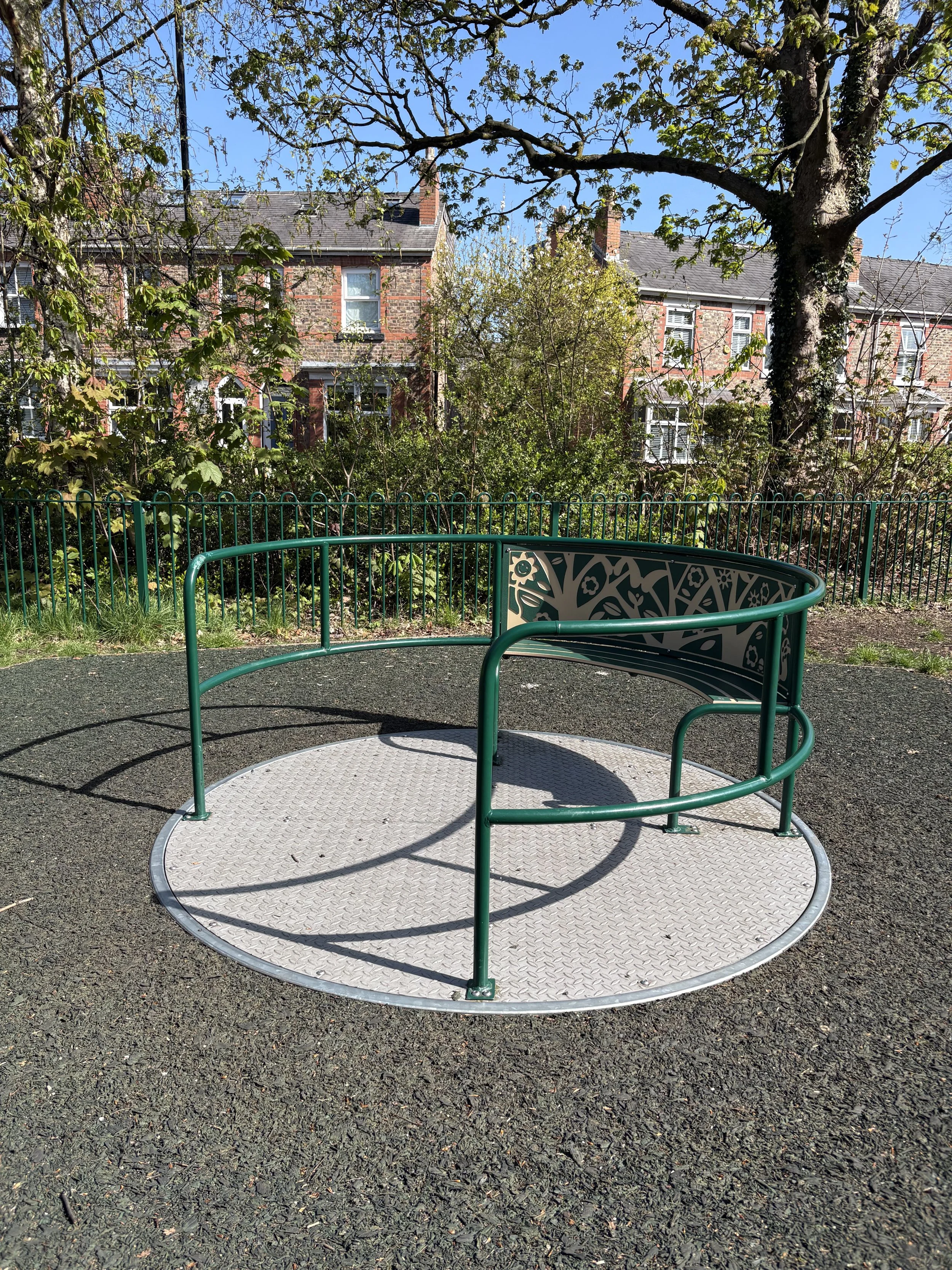 the roundabout at the children's play area in stamford park