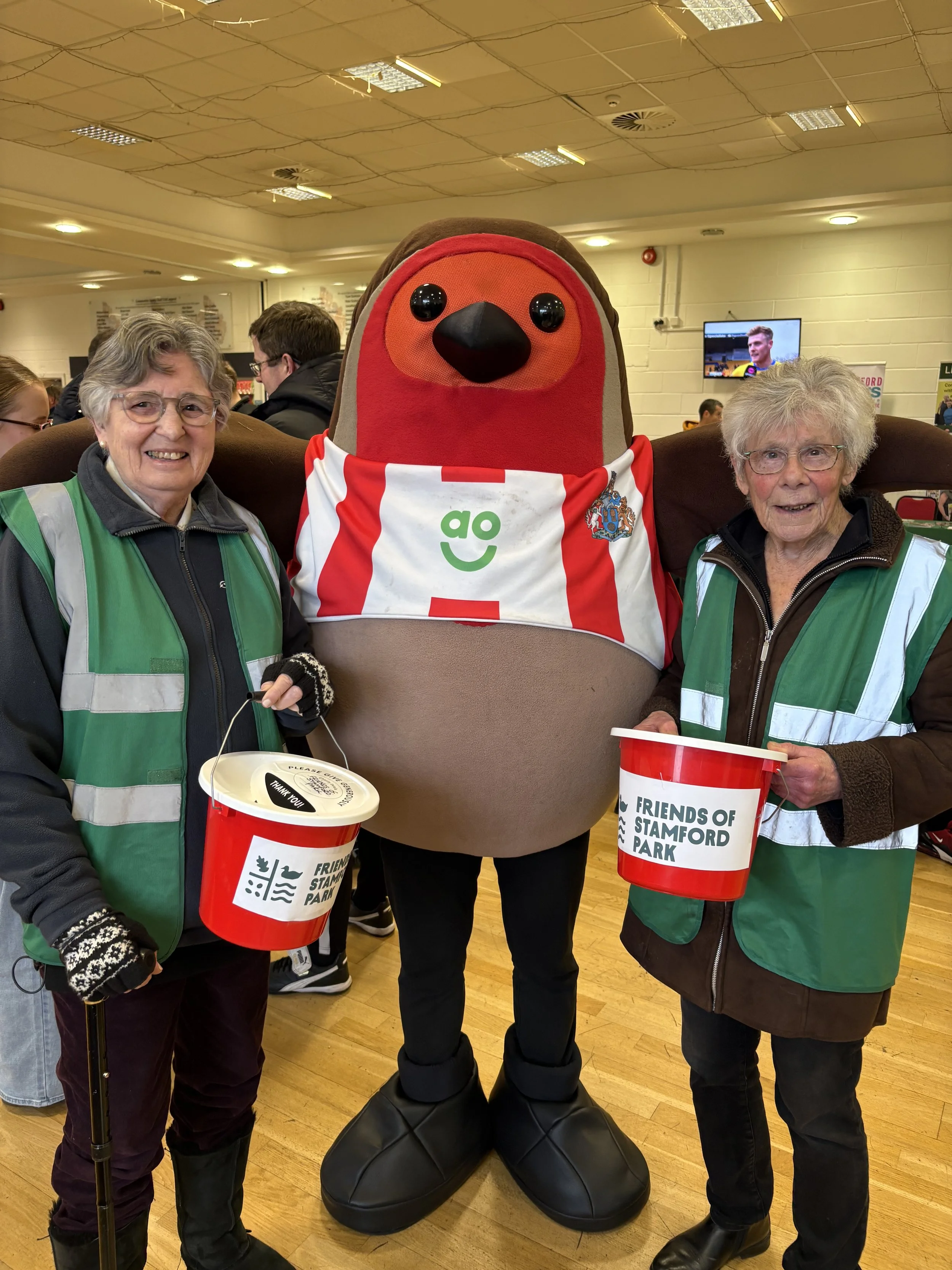 a couple of our volunteers raising money for the park, at Altrincham FC's stadium