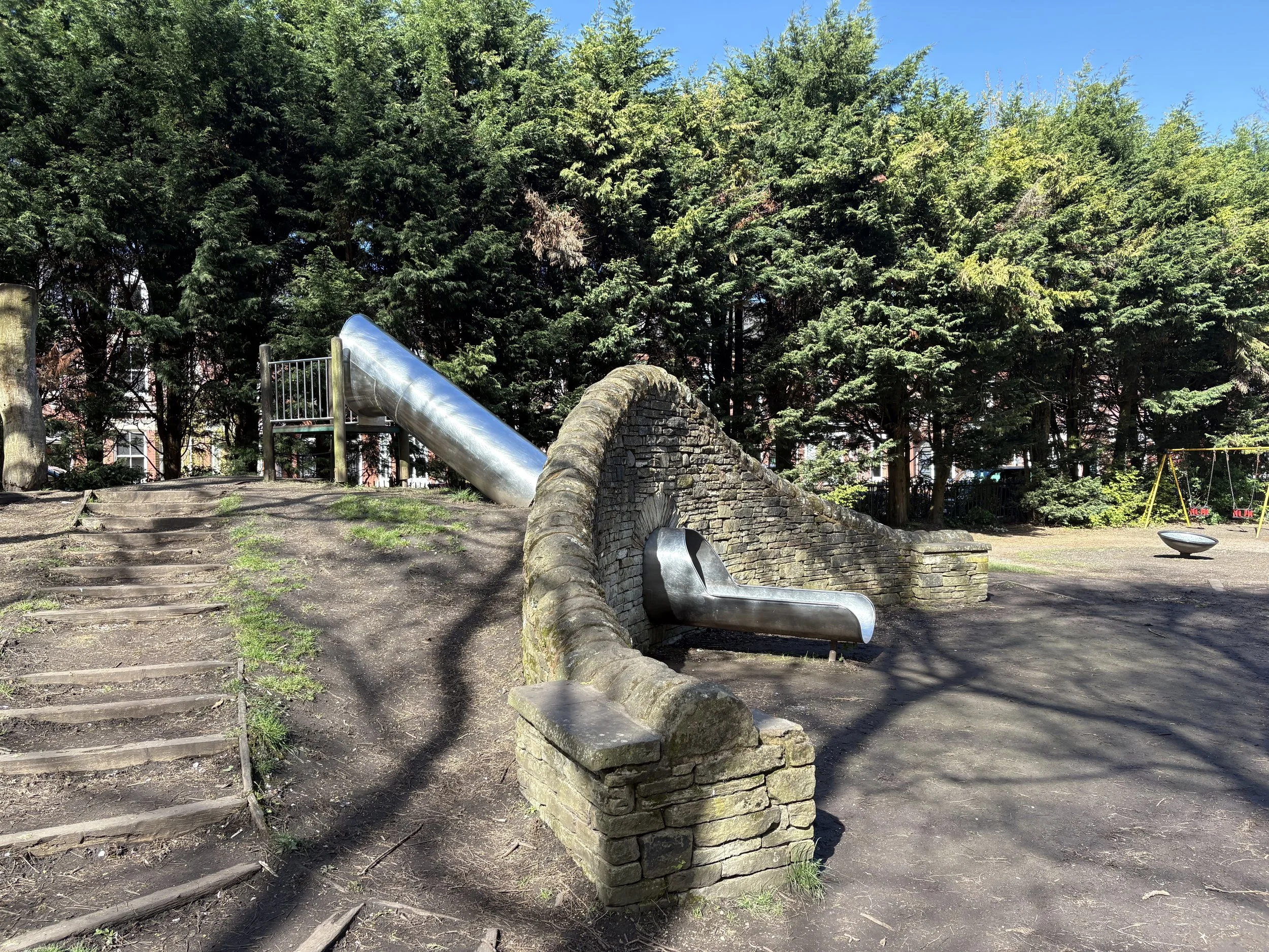 the steel slide in the children's play area at stamford park