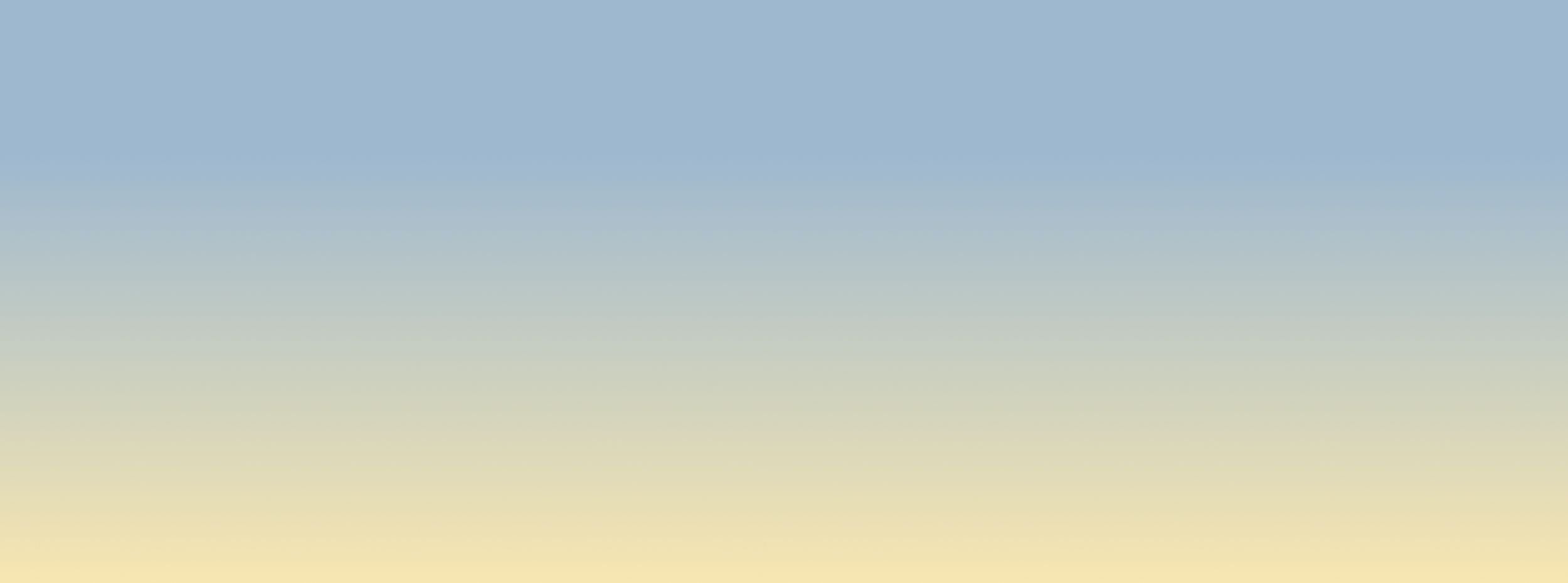 A blurred image showing a gradient from blue at the top to beige at the bottom, resembling a sky and ground.
