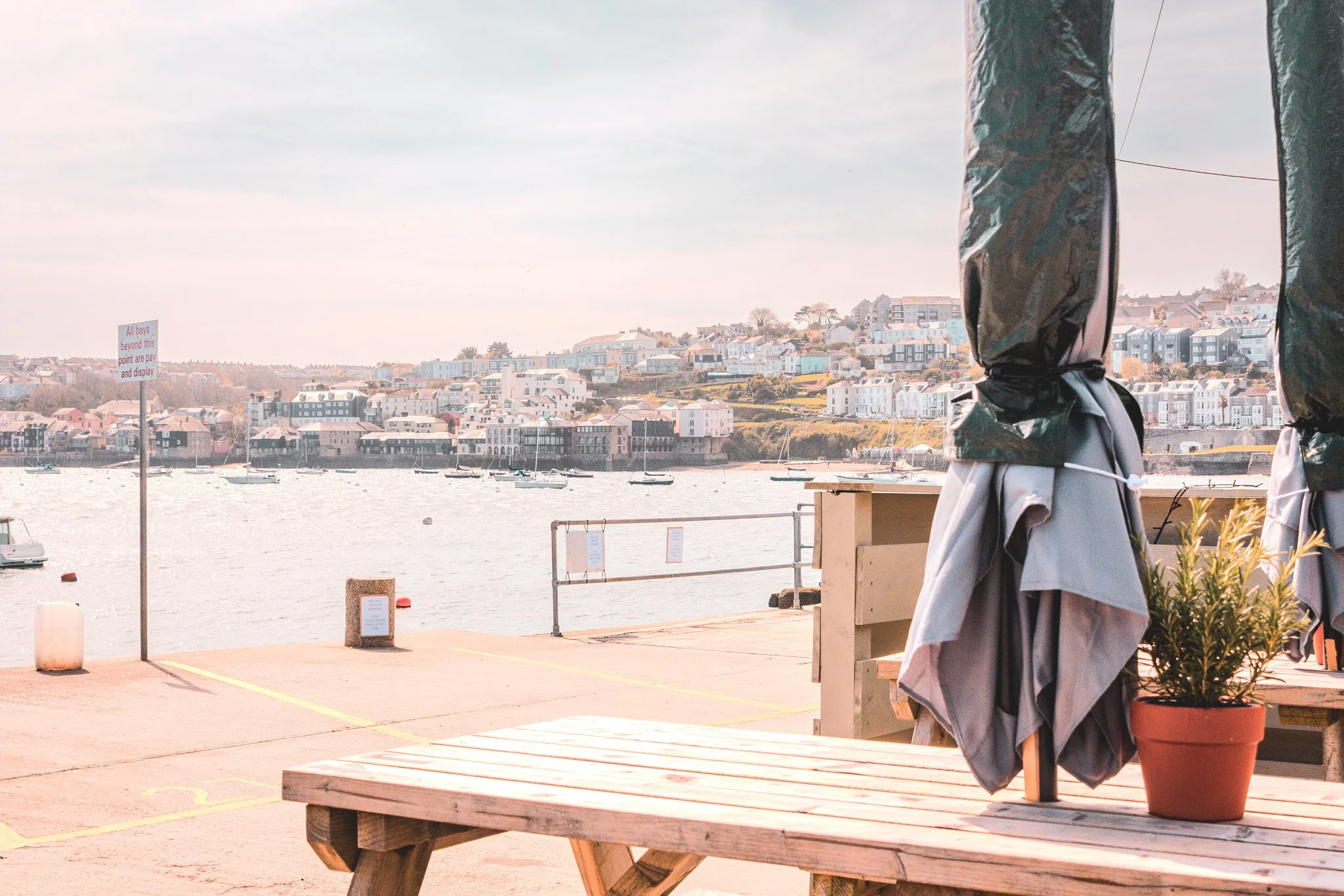 A view across the harbour, of the open water and Falmouth, shot from picnic benches outside Tide