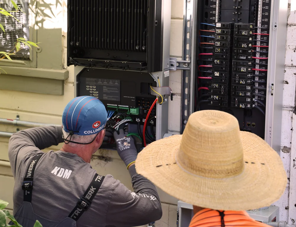 KDM Energy installers connecting the inverter and electrical equipment on site at Court & Current Estate