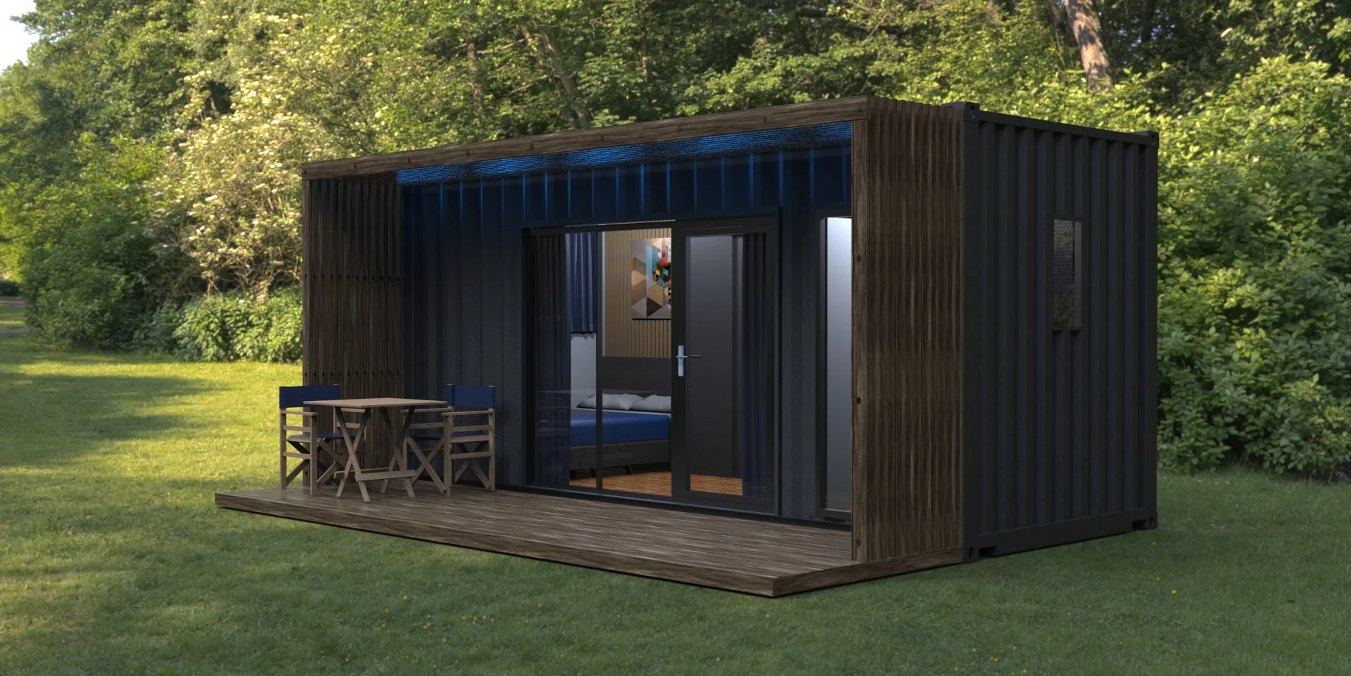 Small modern outdoor cabin with black vertical siding, a wooden deck with outdoor furniture, and large glass sliding doors, set in a lush green wooded area.