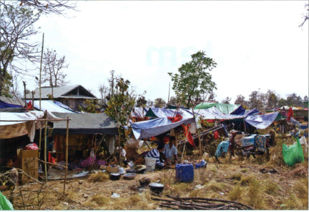 Makeshift tents, cooking utensils, and personal effects at a refugee camp at Takeung
