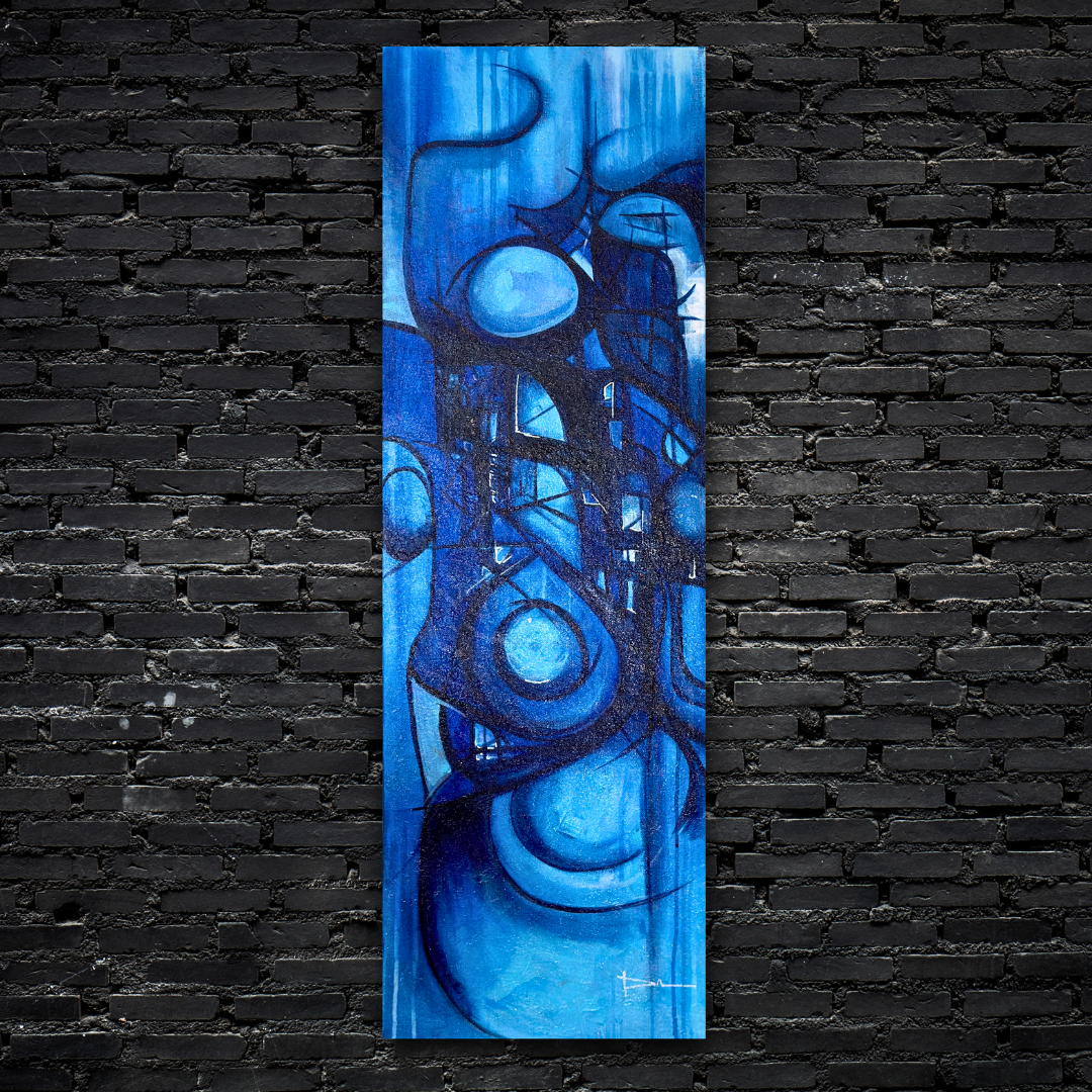 Abstract blue geometric painting on a tall canvas against a black brick wall.