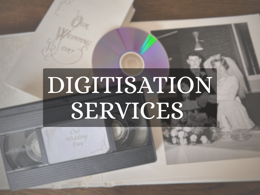 A photo of an old wedding photo book, wedding VHS and DVD. Linking our Digitisation Services