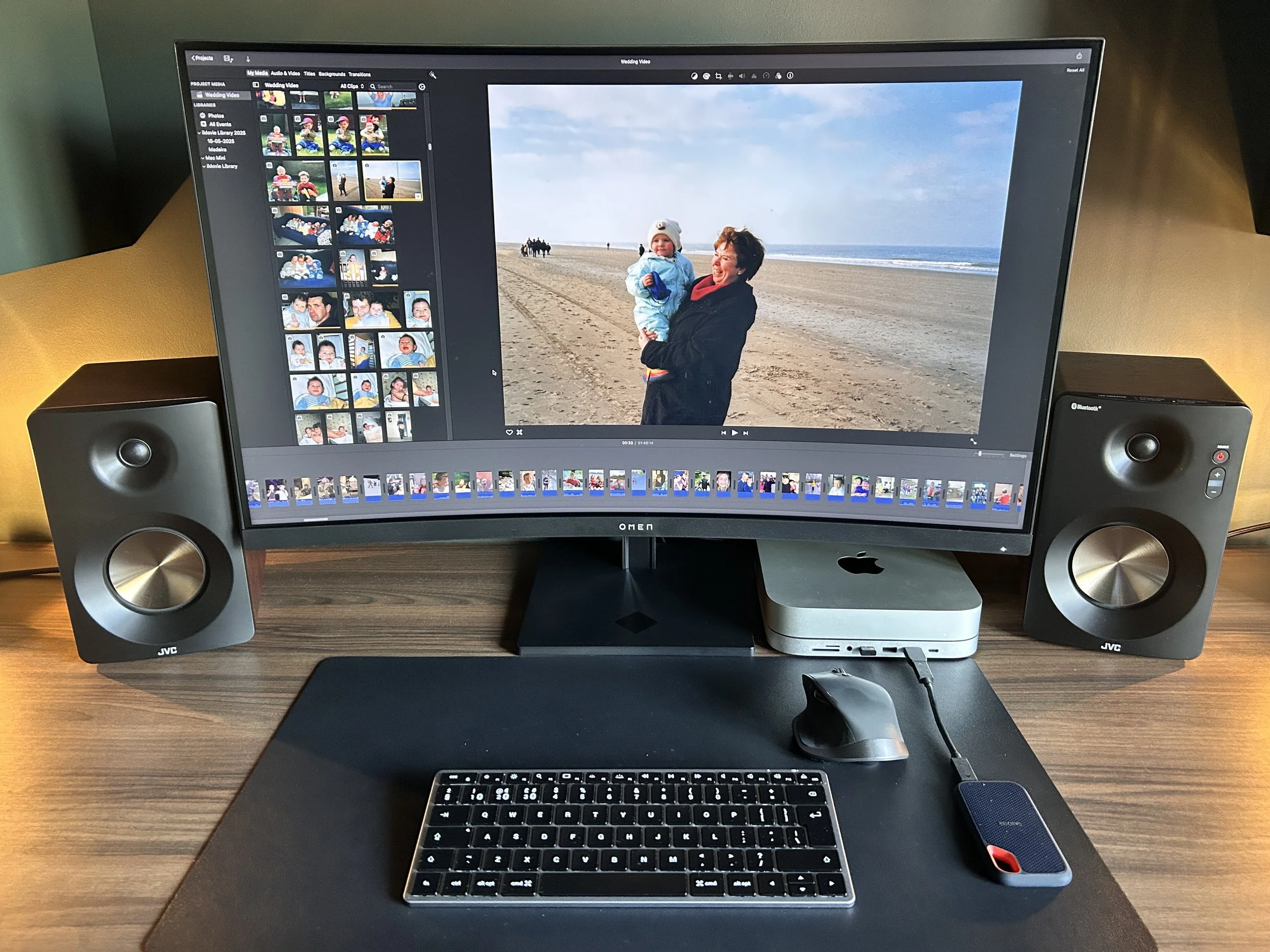 A photo of a computer setup showcasing the editing process of a tribute video
