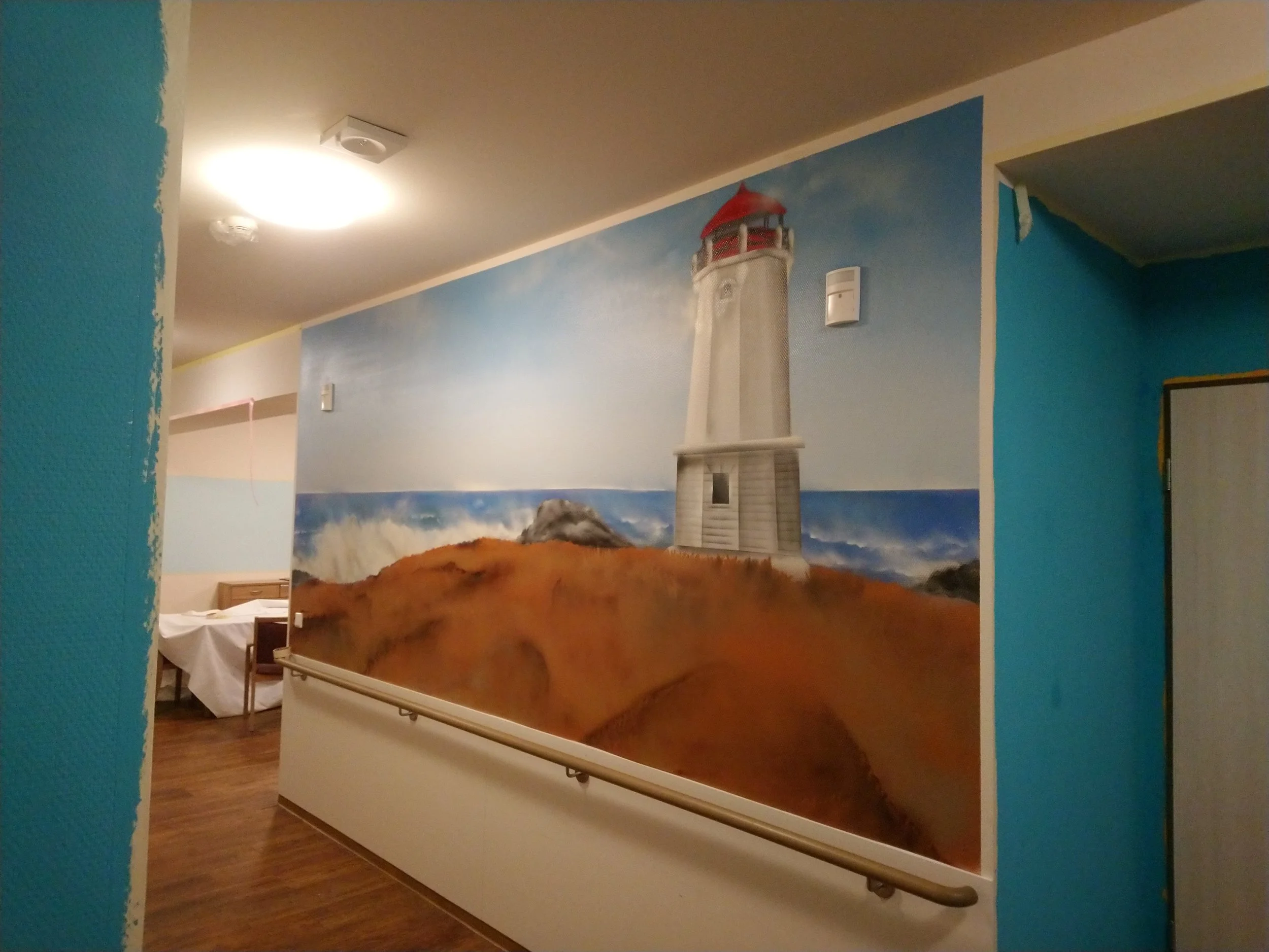 Wandbild eines Leuchtturms auf einer Klippe am Meer