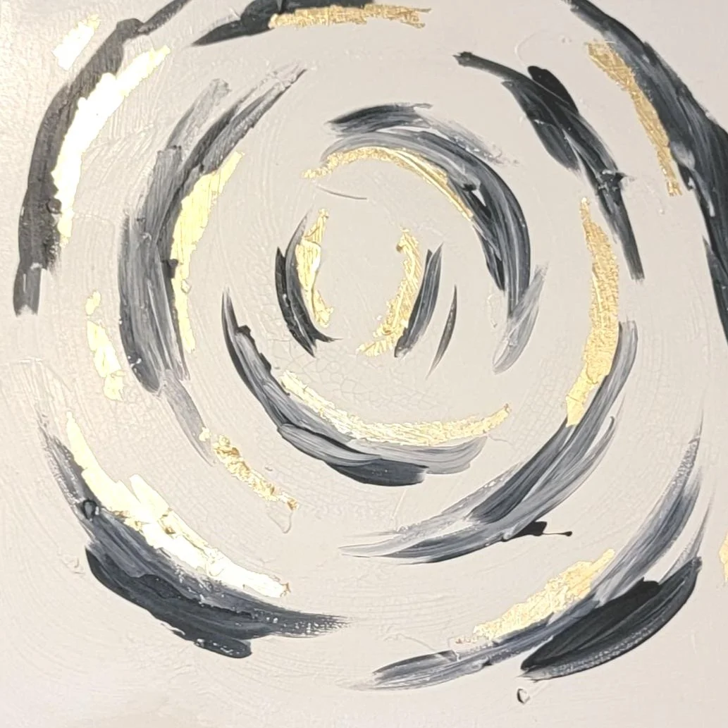 Abstract painting with black and gold spiral design on a white background.